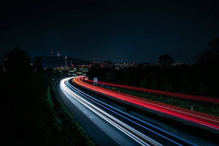 A highway at night in long exposure, headlight trails